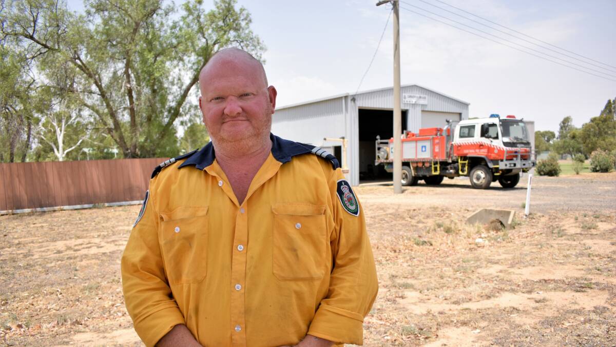 TRIUMPHANT RETURN: Carrathool Rural Fire Service captain Rob Liddle spent Christmas battling bushfires in Nowra. Over three exhausting he days battled bushfires, protected houses, and cleared up hazards. PHOTO: Kenji Sato