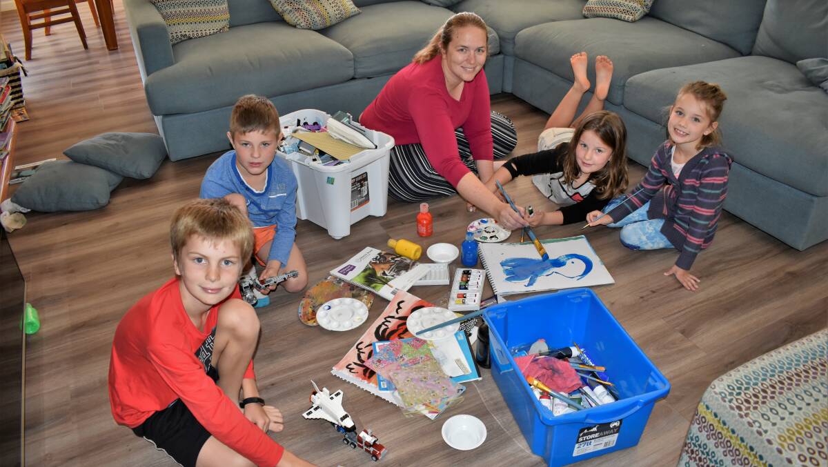 CRAFTY: Leithan Wallace, Jaxon Ison, Bel Wallace, Zara Wallace, and Lily Ison getting creative with boxes upon boxes of art supplies and Lego - or "in-real-life Minecraft" as it's come to be known these days. PHOTO: Kenji Sato
