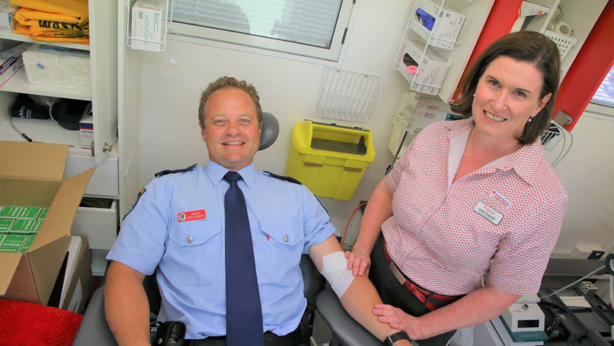 BRAVE: Griffith Inspector Nick Seddon and Australian Red Cross community relations officer Cathy Chapman. Picture: Anthony Stipo