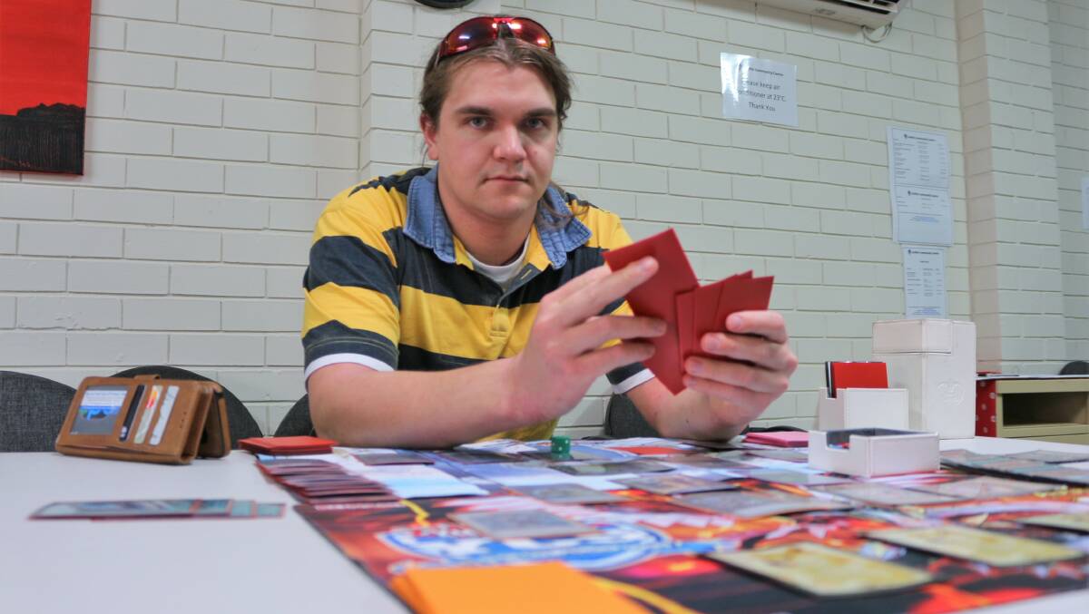 TIME TO DUEL: Sean Beecher has a deep love of the YuGiOh! card game and all of its various subtleties and intricacies. Picture: Kenji Sato