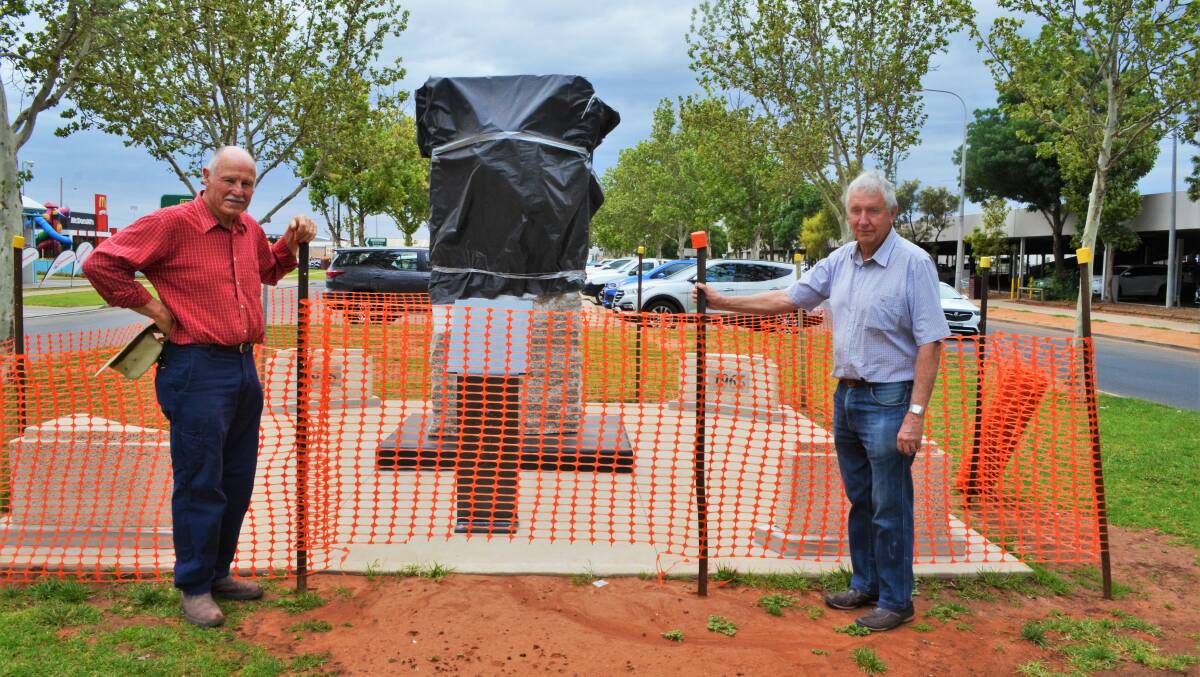 COMING SOON: Rotary members Noel Hicks and Allan Smith eagerly await the unveiling. Picture: Kenji Sato