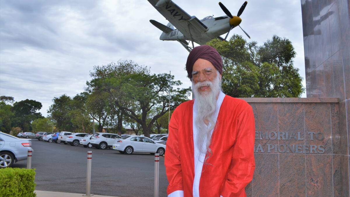 JOLLY: Amarjit Singh gets in the spirit of Christmas. Picture: Kenji Sato