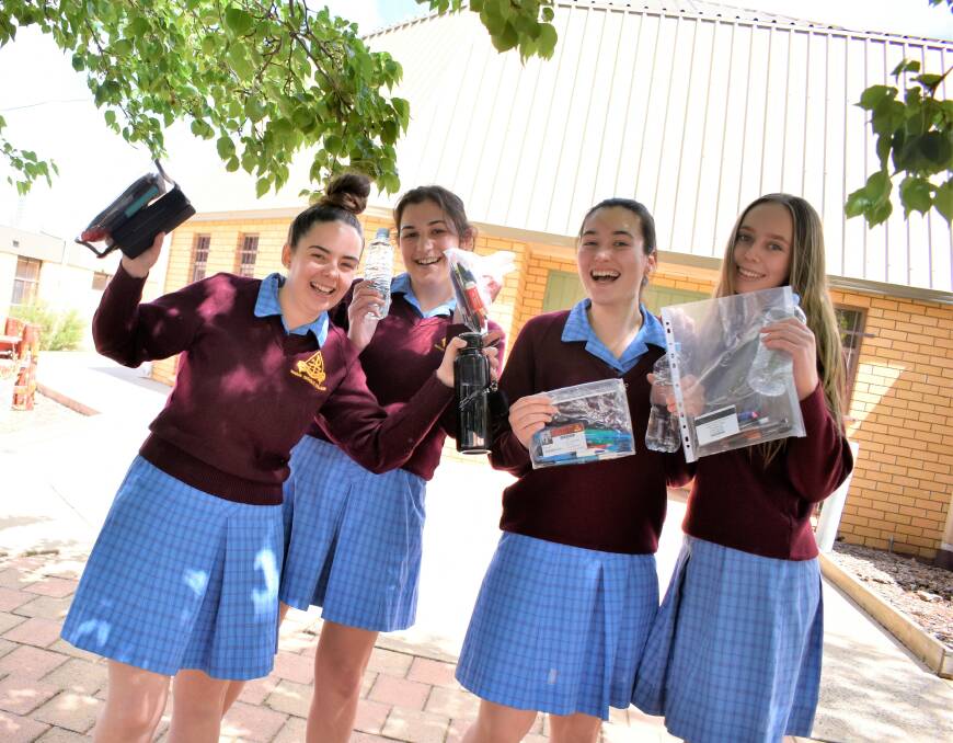 RELIEVED: Cornelia Potgieter, Talissa Cerato, Teneeka Andreazza, and Chelsea Colpo triumphantly finish their HSC English exam. PHOTO: Kenji Sato