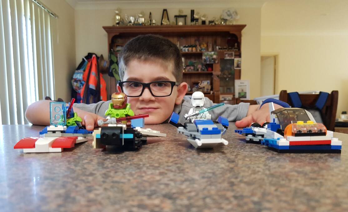 MASTER BUILDER: Beelbangera Public School student Rory Lassock will be showcasing his finest Lego masterpieces at the Griffith Brick Fair on Sunday. PHOTO: Contributed