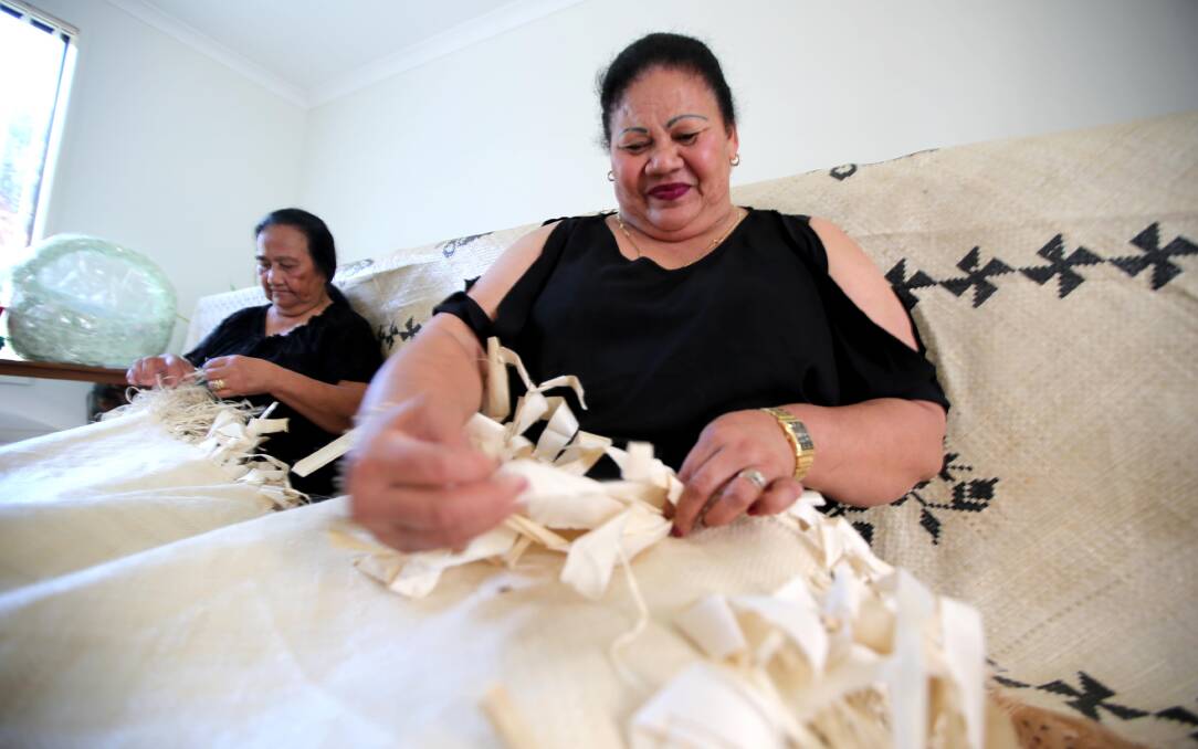 BUSY: Litia Kosi and Siniva Finefuiaki hand weave a traditional Tongan mat, which will be used for special moments. PHOTO: Anthony Stipo