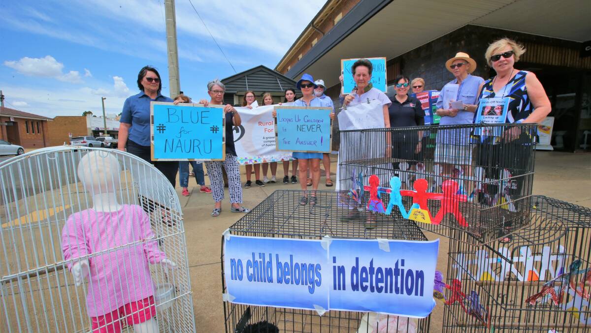 PROTEST: Rural Australians for Refugees hit the streets on the corner of Banna Avenue and Kooyoo Street. Picture: Anthony Stipo