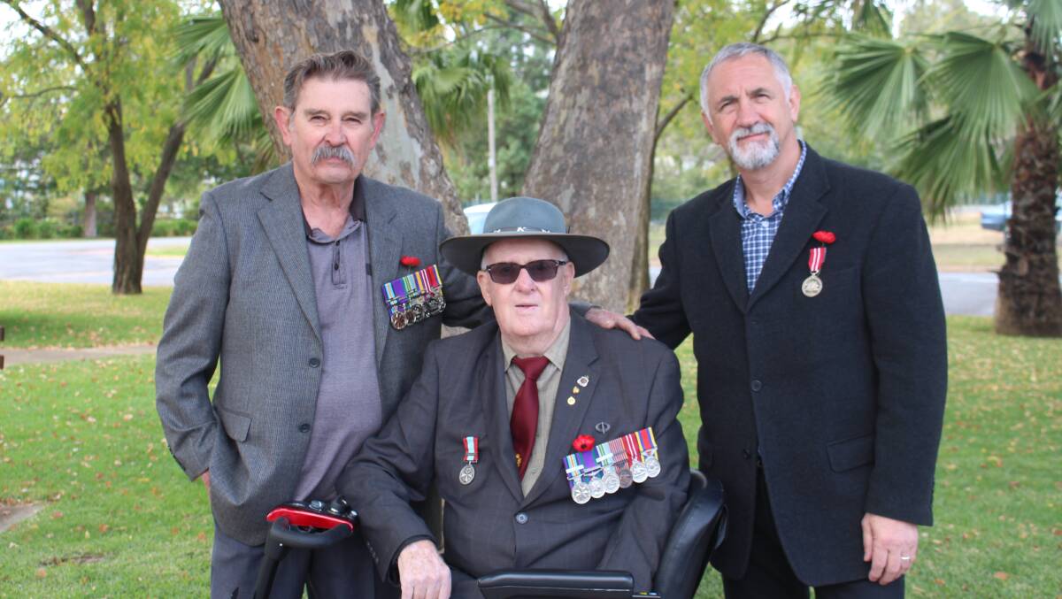 MATES: Ian Gilmore, Fred Smith and George Buscema attend the service together.