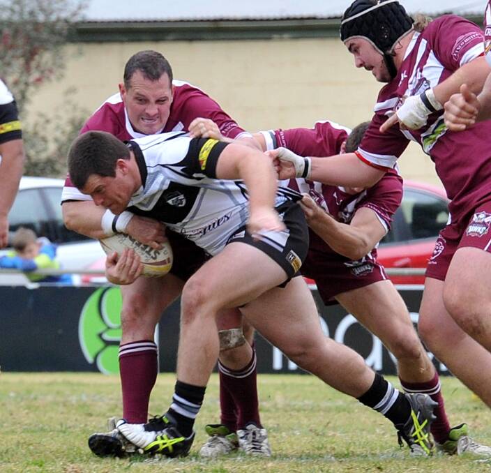 LEG DRIVE: Black and Whites co-coach David Milne gets brought down against Yanco-Wamoon earlier this year. Picture: Anthony Stipo.