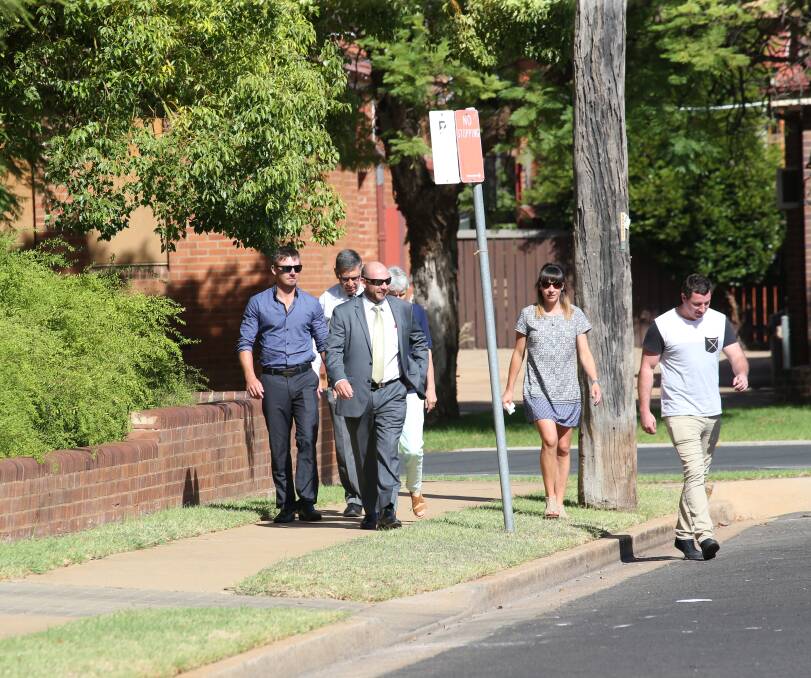 DATE SET: Stephanie Scott's fiance Aaron Leeson-Woolley leaves Griffith Local Court with the murdered school teacher's family. Picture: Anthony Stipo