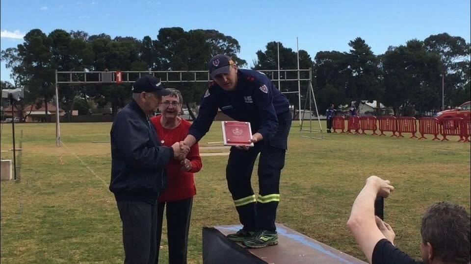Charlie and Judy present an award at the NSW fire brigade championships held at Griffith in 2019.