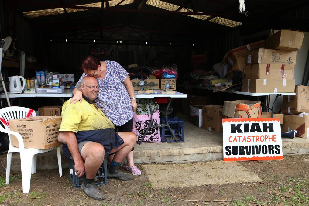 Trevor and Sue Jones at the tiny relief centre at Kiah. The couple are keen to rebuild. Picture: Sylvia Liber
