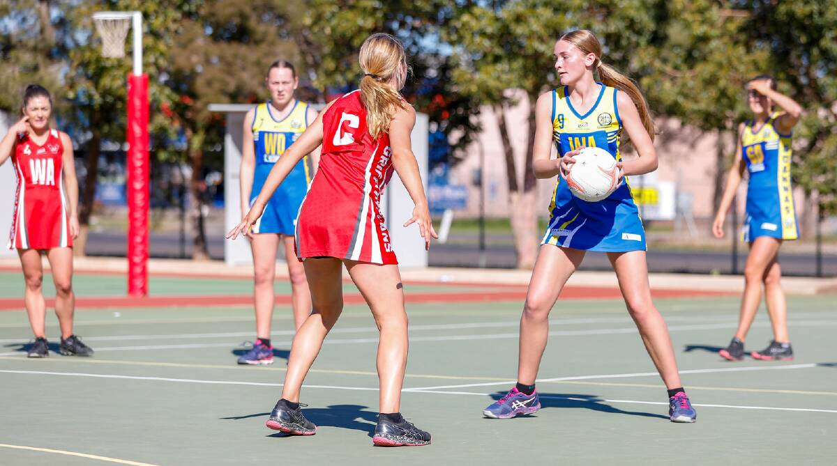 YOUNG GUN: MCUE centre Phoebe Wallace looks to make a pass during her sides' win over Griffith. Picture: Andrew McLean Photography