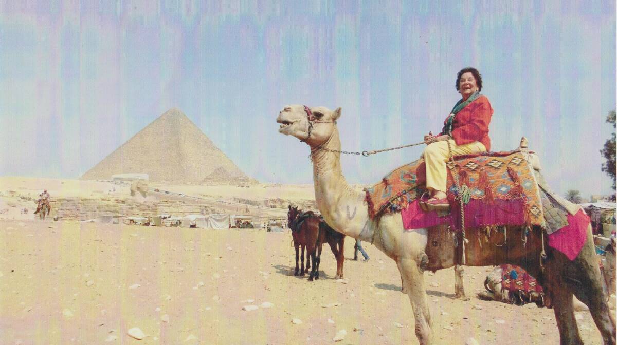 RETRACING THE STEPS OF SERVICE: Yvonne Bromley sits on a camel in almost the same spot where her uncle sat during his WWI service. PHOTO: Supplied.