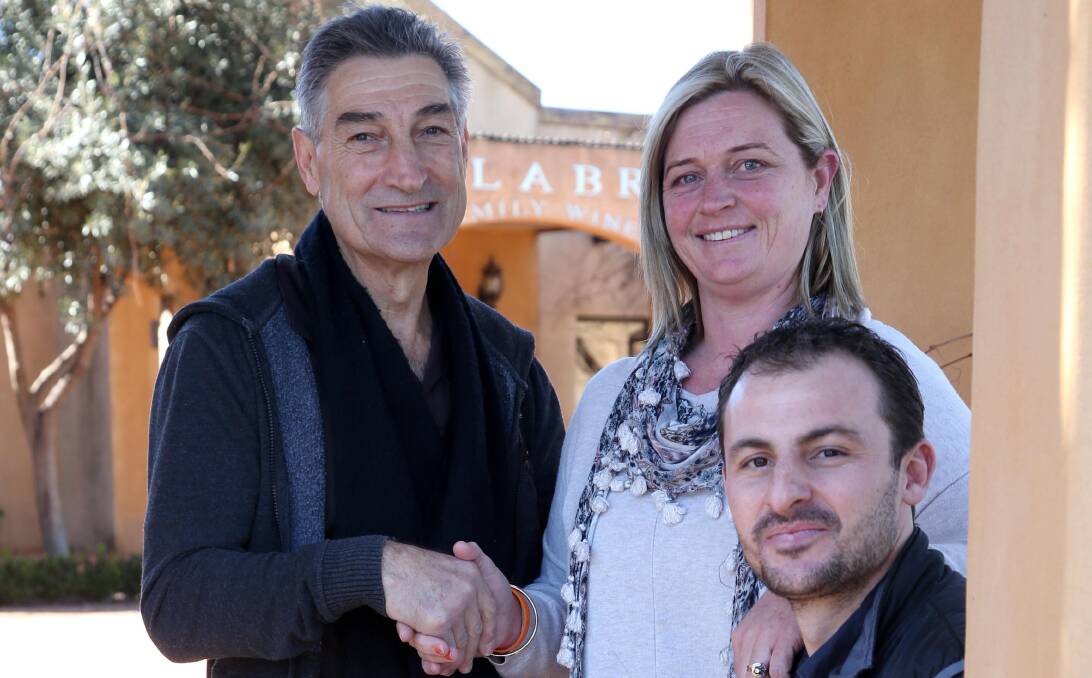APPRECIATED DONATIONS: Brian Calabria from Calabria Wines and Chase Staltare from Liftek with Tilly's mother Fiona Smith. Picture: Anthony Stipo.