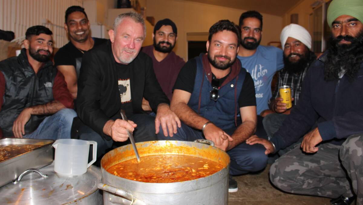 CURRY AND JAM: Bobby Singh, Sunny Singh, Robert Gilbert, Harry Singh, Prince Singh, Ricky Singh, Toni Singh and Harman Singh all selflessly donated their time to cook a delicious meal on the night. Photo: Hannah Higgins.