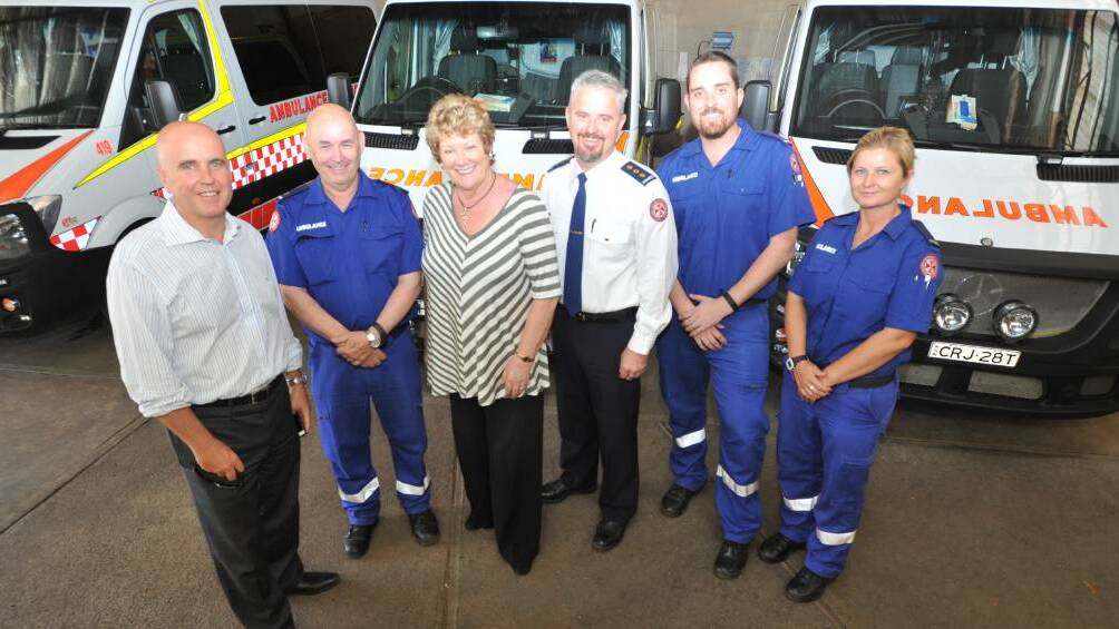 CASH INJECTION: Adrian Piccoli, John Murphy, NSW Health Minister Jillian Skinner, Andrew Long and paramedics Nathan O'Brien and Alissa Fuller. PHOTO: Anthony Stipo