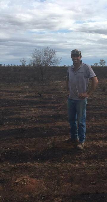 AFTERMATH: Scott Campbell in the paddock he lost to the fire. Properties along the highway remain vulnerable to carelessness.