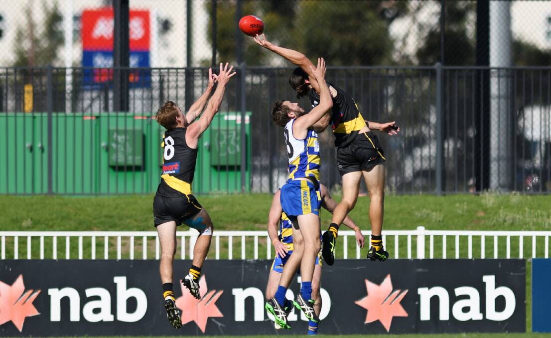 Dylan Morton (left) in action for Wagga Tigers against MCUE last Saturday.