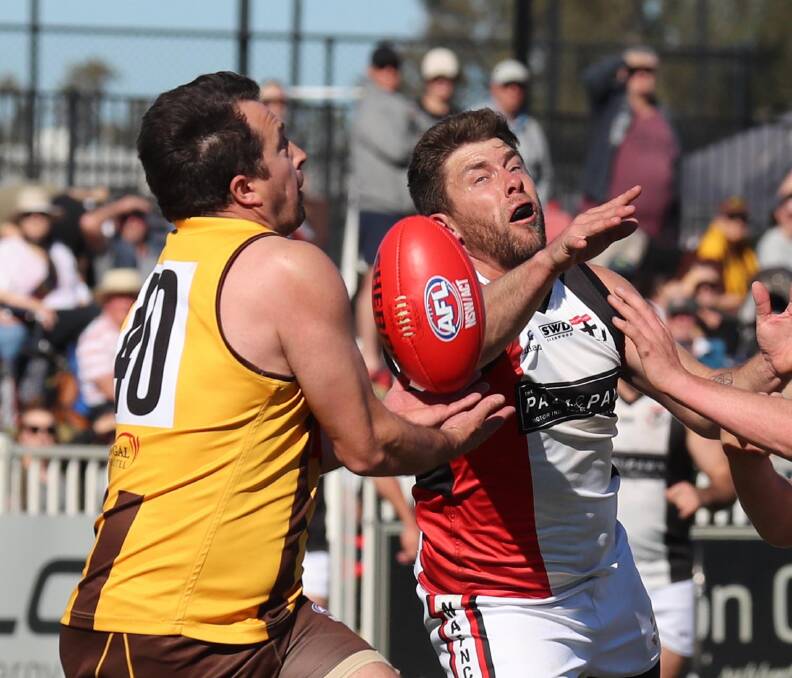 Chris Ladhams and Matt Thomas compete in this year's Farrer League grand final. Both East Wagga-Kooringal and North Wagga will have their spend for this year reviewed.