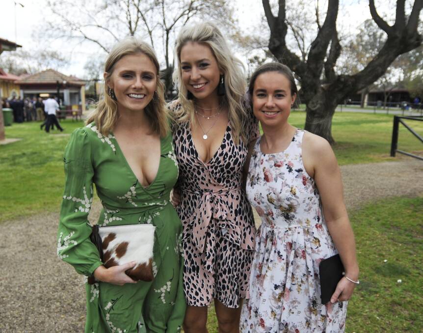Edith Gregory, Jayne Upston and Stephanie Cochrane enjoy this year's Ag Races at Murrumbidgee Turf Club. Picture: Chelsea Sutton