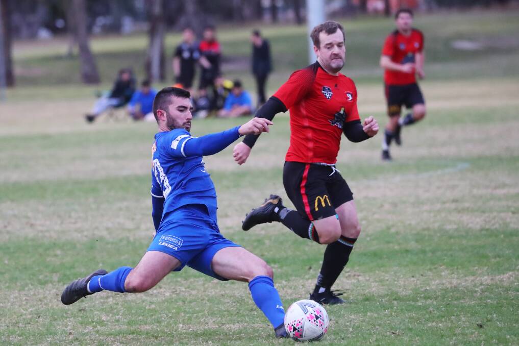 GETTING LOW: Hanwood's Daniel Andreazza looks to send his team forward in the 3-1 win over Lake Albert at Rawlings Park on Sunday. Picture: Emma Hillier