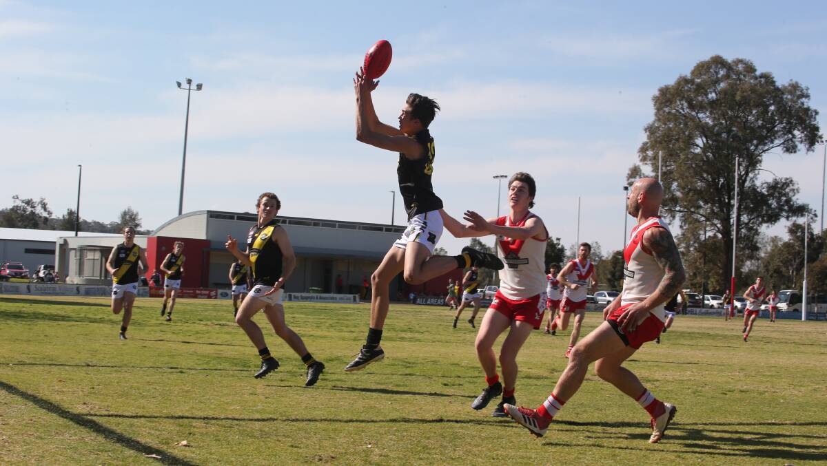 STRONG: Wagga Tigers' Lewis Gooden marks against Griffith.