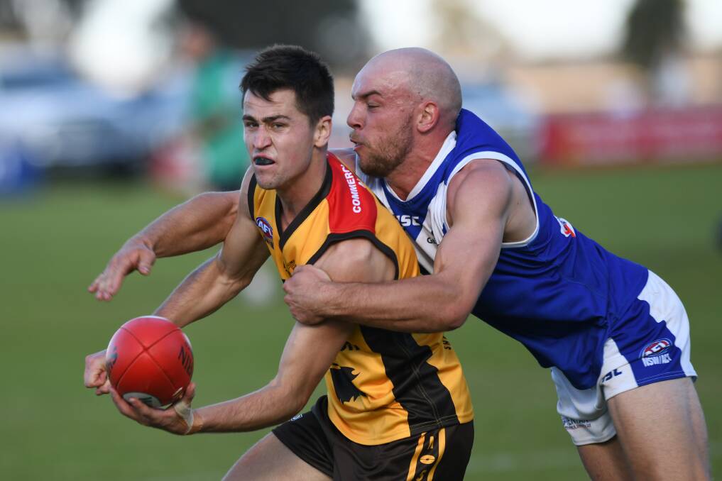 Farrer League's Brayden Ambler pounces on Hume League's Ryan Speed in the interleague game at Osborne this year.
