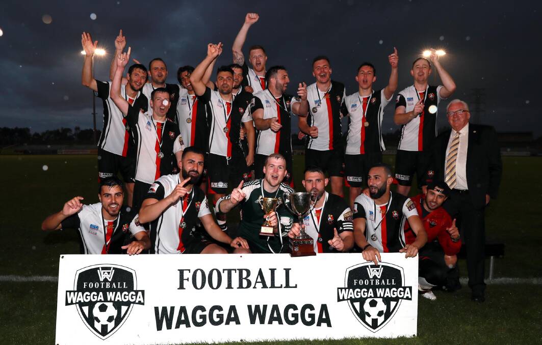 CHAMPIONS: Leeton United celebrate their first premiership in 27 years with victory in the Pascoe Cup grand final on Sunday. Picture: Les Smith