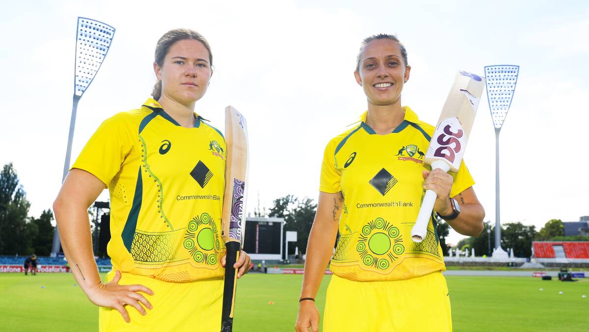 Hannah Darlington and Ashleigh Gardner in Australia's specially designed Indigenous kit at Manuka Oval. Picture: Supplied