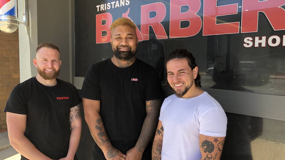 GROOMED: Tristan Sergi (left) and barbers Leka Mafi and Remy Perez say it's important as men to look after yourself. PHOTO: Kat Vella