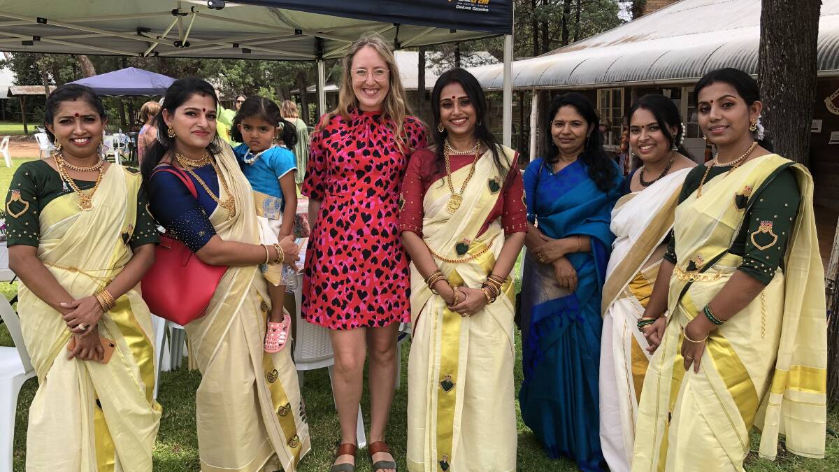 DIVERSITY: Members of the spectacular women's dance troupe 'Rhythm' chat with Lucy Geddes (centre) about her current role as the head of the Sri Lanka office for Legal Action worldwide. PHOTO: Kat Vella