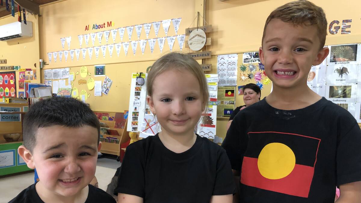 SAY CHEESE: Thomas Dutton, Makayla Castle and Blake Broome smiling for the camera during NAIDOC week activities. PHOTO: Kat Vella
