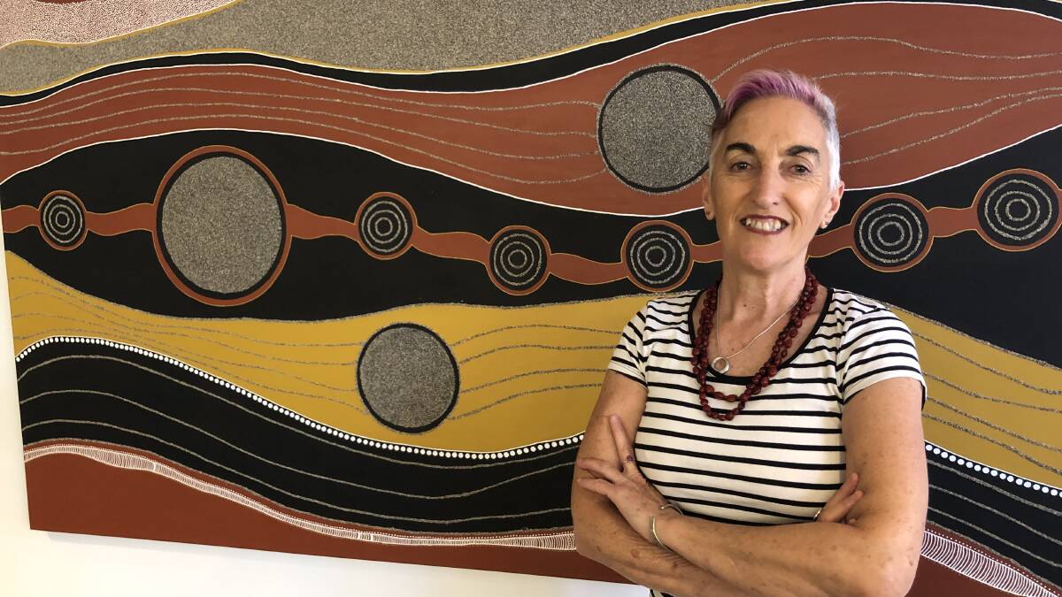 EXCITED: Theatre manager Raina Savage says their jam-packed 2021 program has something for everyone. Artwork by Wiradjuri artist Veronica Collins. PHOTO: Kat Vella