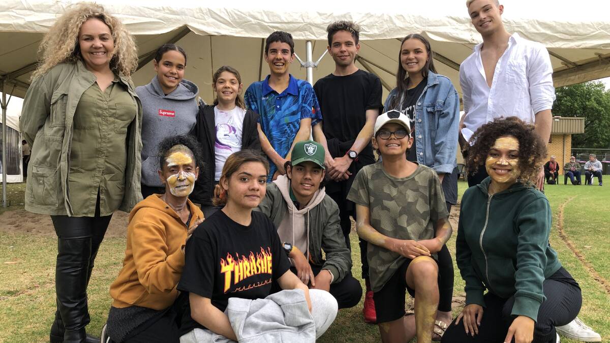 PROUD: Kerry Johnson (far left) with dancers from Burrundi Theatre of the Performing Arts who performed for the opening ceremony at Sunshine Supergirl in Griffith in October. PHOTO: Kat Vella