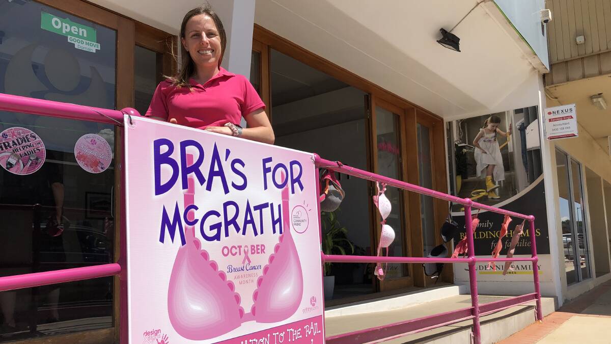 TICKLED PINK: Jessica Zandona outside the Griffith RE office adorned with donated bras PHOTO: Kat Vella