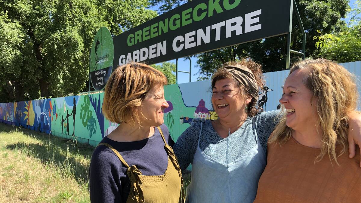 WHAT FRIENDS ARE FOR: Life long friends Di Tarr, Romina Tappi and Lisa Taliano share a joke in front of their mural fence at the Green Gecko Garden Centre. PHOTO: Kat Vella