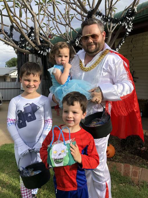 ELVIS LIVES: Kodie Mansell with his three children Ruben, Axel and Sadie trick or treating around Griffith Saturday. PHOTO: Kat Vella