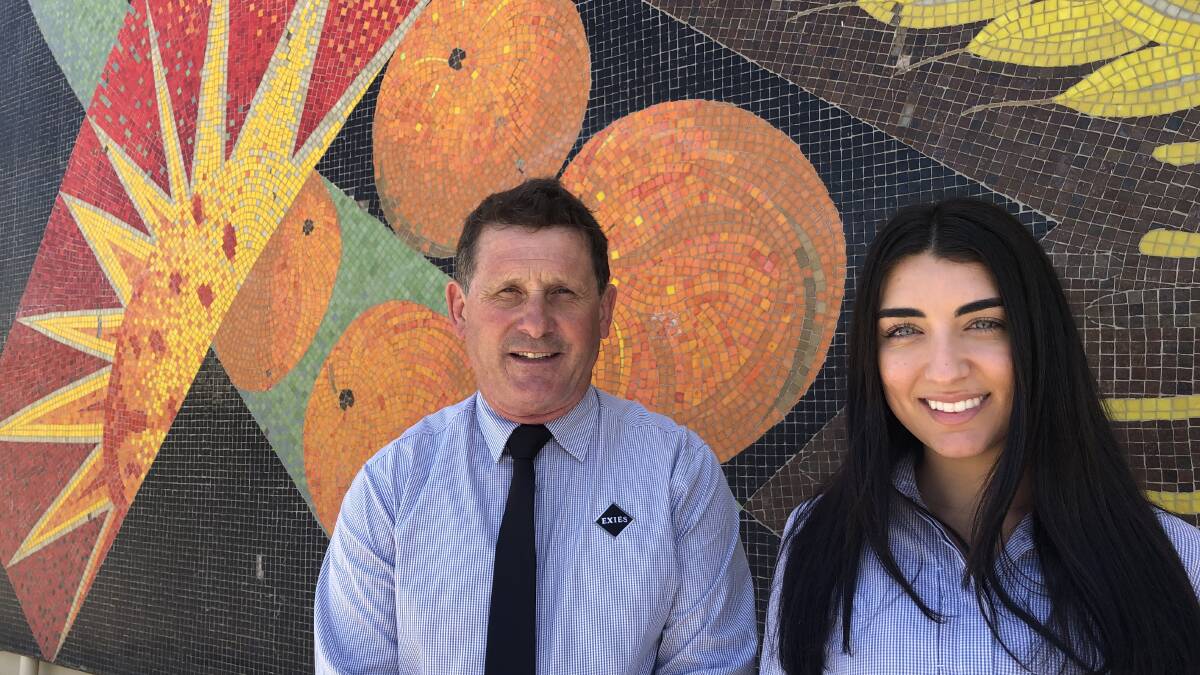 COMMUNITY MINDED: General Manager Garry Tucker with staff member Francine Barbaro. Mr Tucker says that Exies have prioritised the community this year. PHOTO: Kat Vella
