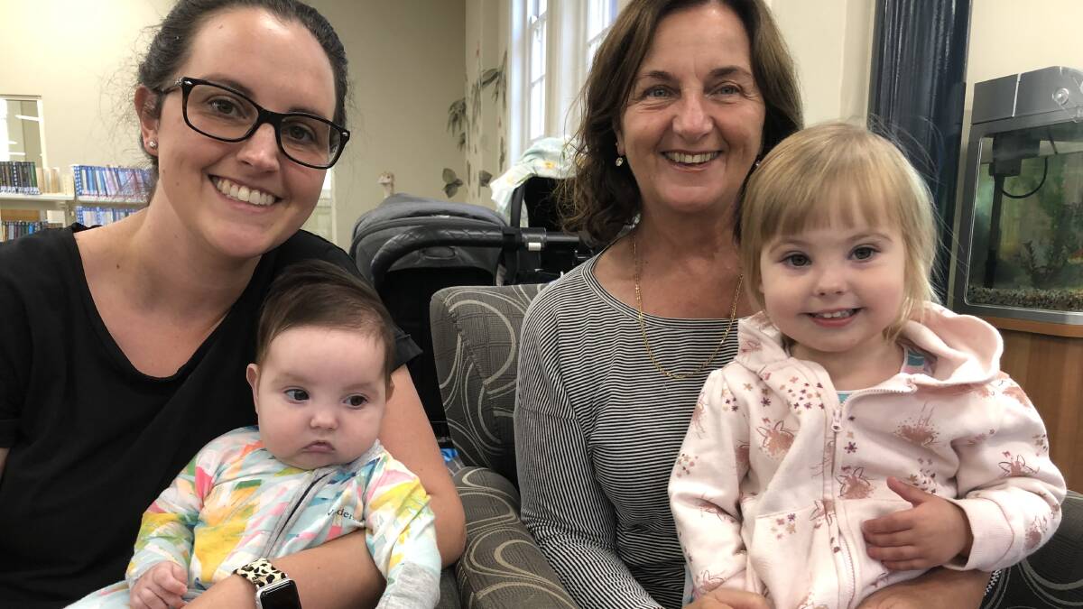 ALL SMILES: Nevis Gill, Elise Dotta, Sienna Dotta and Steffanie Dotta among the first to enjoy Rhyme Time's return to Griffith City Library's programs. PHOTO: Kat Vella
