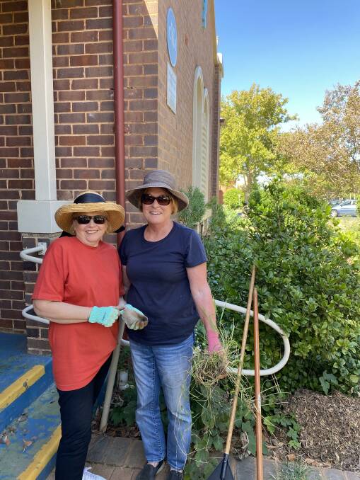 GETTING THEIR HANDS DIRTY: Griffith CWA Branch president Cheryll Steele with member Lesley Higgins at Saturday's working bee. PHOTO: Supplied