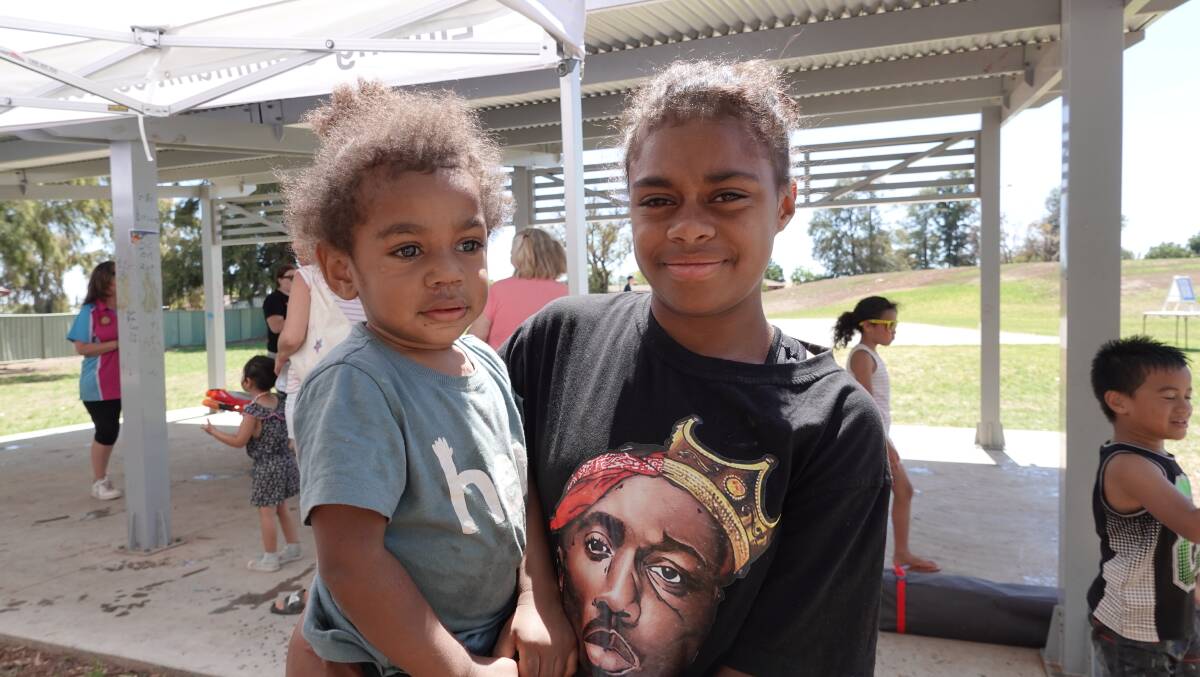 SUN AND FUN: Bella Ratu holding Jeremiah Jayisi at Dave Taylor Park's activities. PHOTO: Monty Jacka
