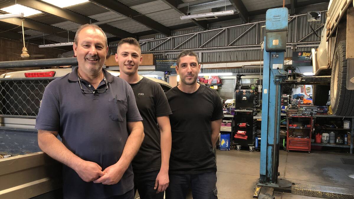 BE PREPARED: Aflio Guglielmino (left) recommends getting in to you mechanic early before a road trip. Pictured with mechanics Brandon Guglielmino and Matthew Napoli. 