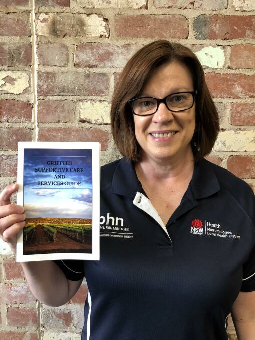 VITAL RESOURCE: Margaret King with the Griffith Supportive Care and Services Guide. PHOTO: Kat Vella