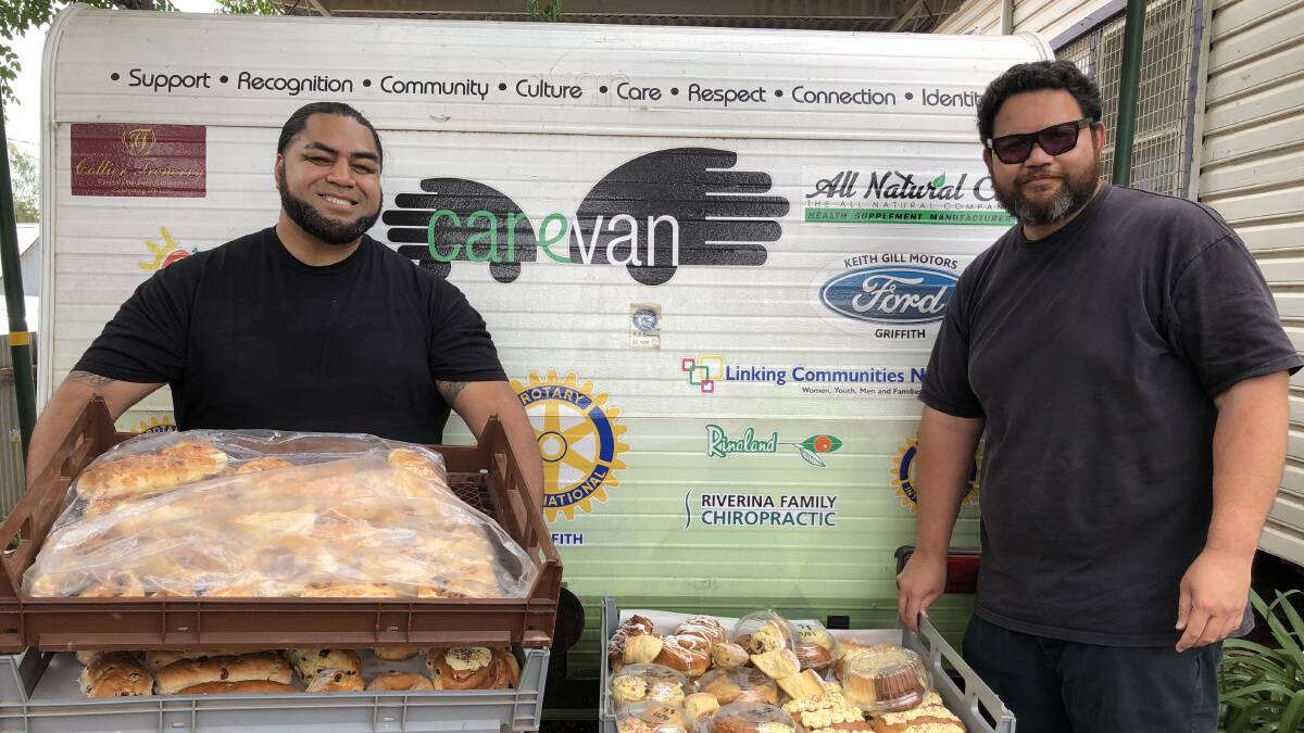 DELIVERY: Chris Tao and Sula Kosi from Linking Communities Network with a bread donation for the Carevan from Vicaris bakery. PHOTO: Kat Vella