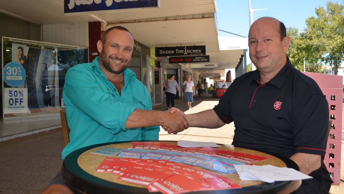 Drought relief: manager for GIVIT NSW Scott Barrett with Salvation Army chaplain Jon Belmonte put local charity on the cards during their meeting over hot coffee on Banna Avenue last week. Picture: Reuben Wylie