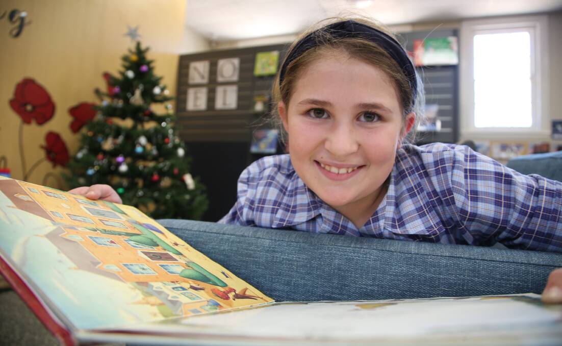 Avid reader: Emma Cunial is no library stranger and will be well practiced for this year's reading club. Picture: Anthony Stipo. 