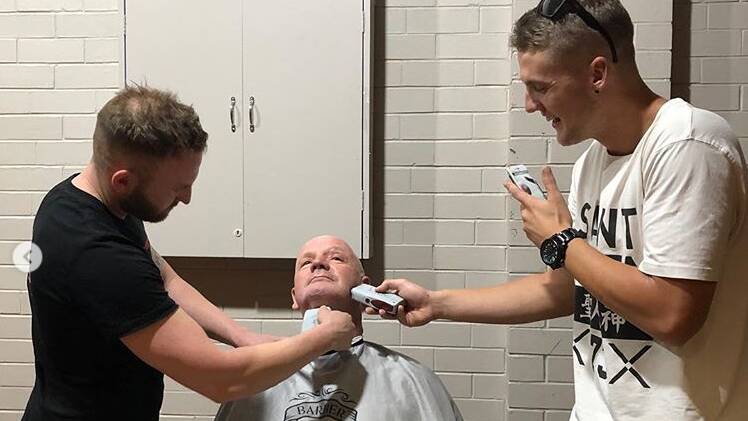 Hanwood truck driver Graham Carroll and a mysterious man from Wollongong named Glen raised around $3600 for research into motor neurone disease during a single shaving session 