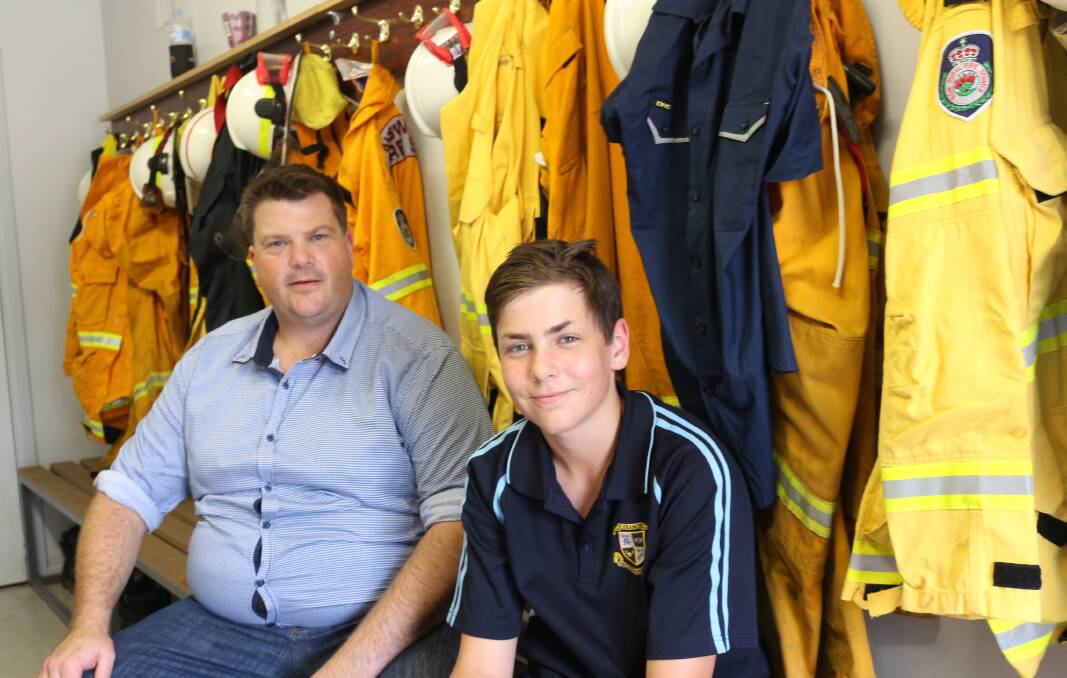 Hanwood fire: Captain Darrell Wallace of the Hanwood Rural Fire Brigade with Callan Wallace of the Junior brigade. Picture: Reuben Wylie