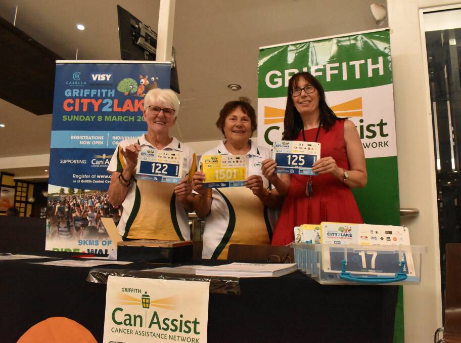 ON TRACK: Margaret McCann, Can Assist's Olga Forner and City2lake committee member Cheryl Wood ready to sign people up and hand out bibs for the event at the Griffith Central registration stall. PHOTO: Jacinta Dickins