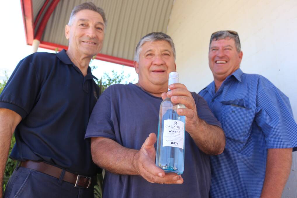 BOTTLED HOPE: Bill Calabria, Tank Sergi, Peter Cremasco are helping Dale McCleary get one megalitre of water to drought-affected communities. PHOTO: Jacinta Dickins